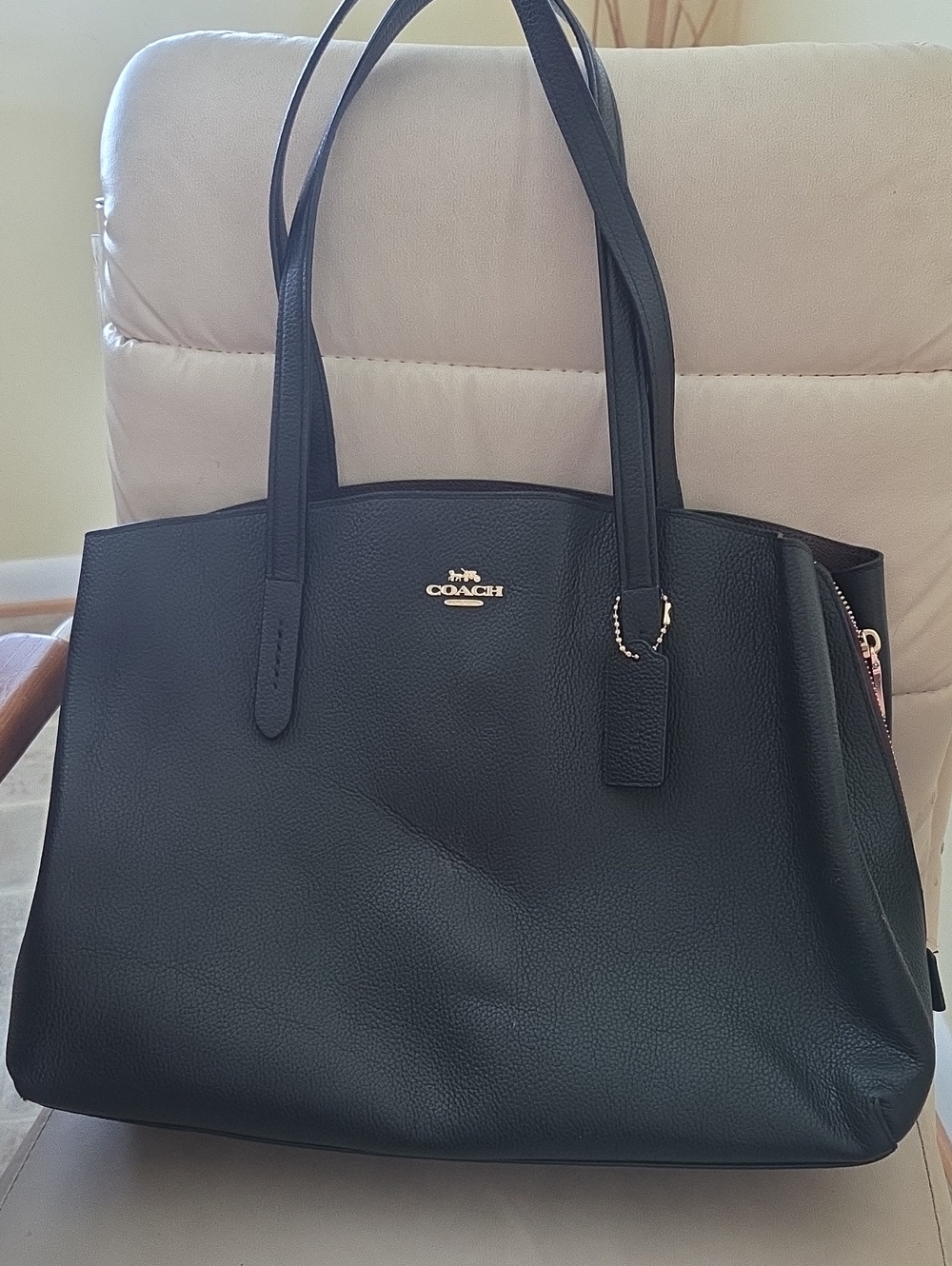 Coach Charlie Carryall 40 in black polished pebble leather